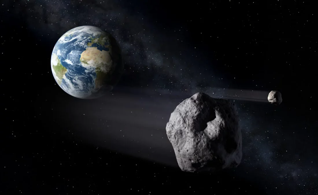 Ilustracja dwóch asteroid przelatujących obok Ziemi. W tle widoczna jest Droga Mleczna.